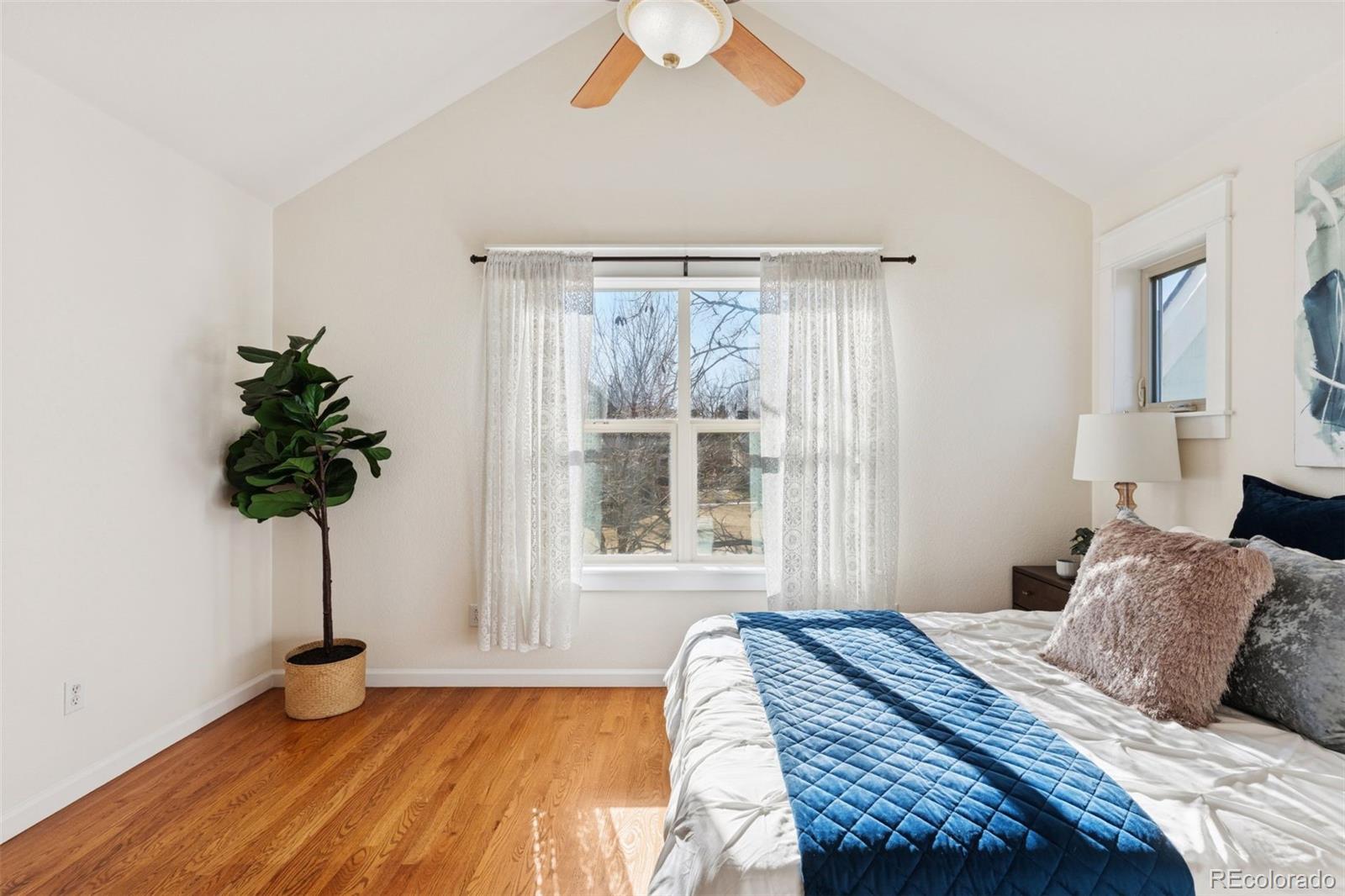 2872 Alton Street Denver, CO 80238 - Photo 19 of 46 a bedroom with a bed and a window