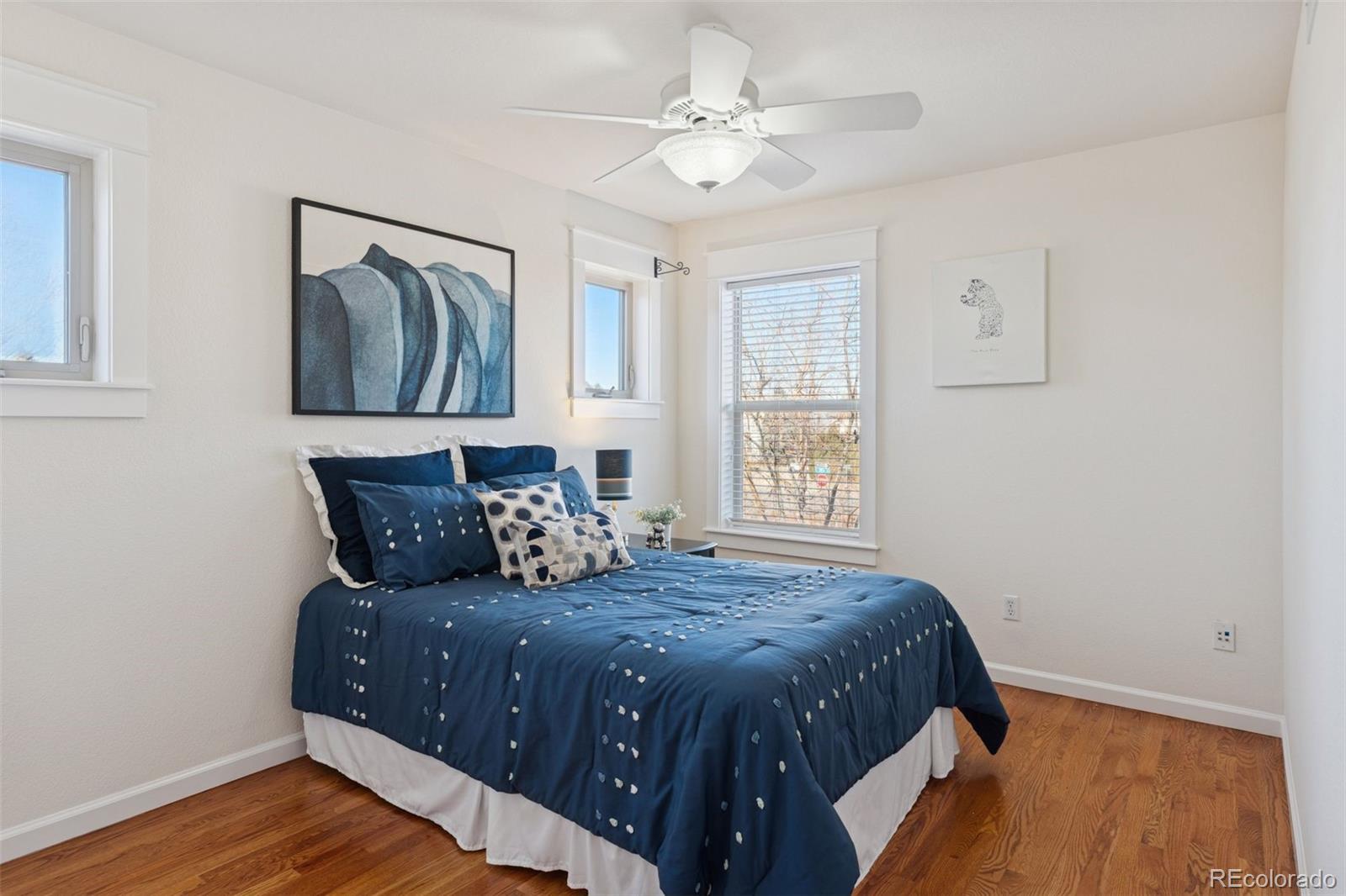 2872 Alton Street Denver, CO 80238 - Photo 26 of 46 a bedroom with a large bed and a window