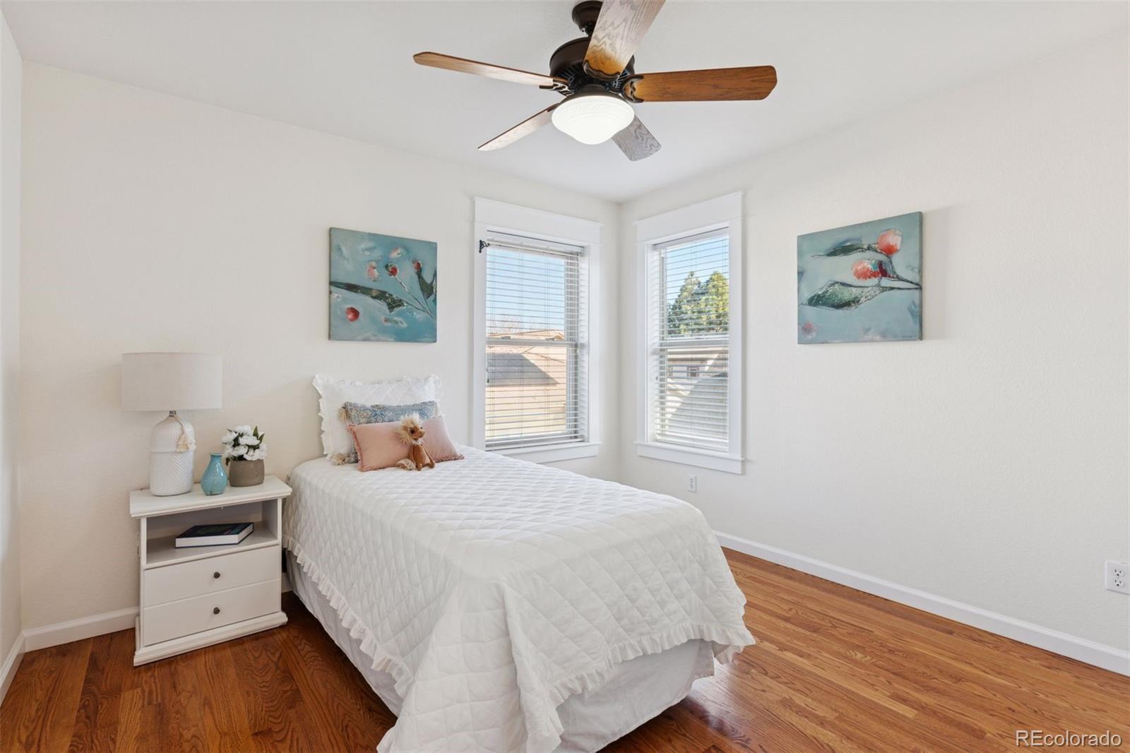 2872 Alton Street Denver, CO 80238 - Photo 28 of 46 a bedroom with a bed and a dresser