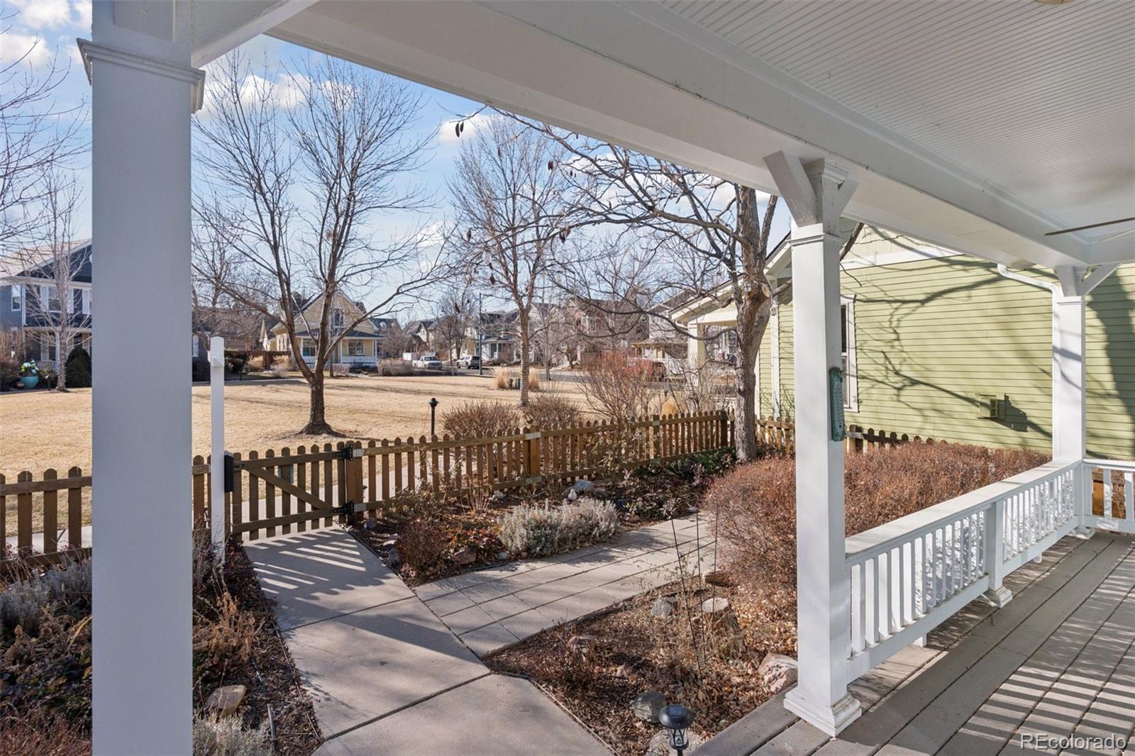 2872 Alton Street Denver, CO 80238 - Photo 3 of 46 a view of a porch with wooden fence next to a yard