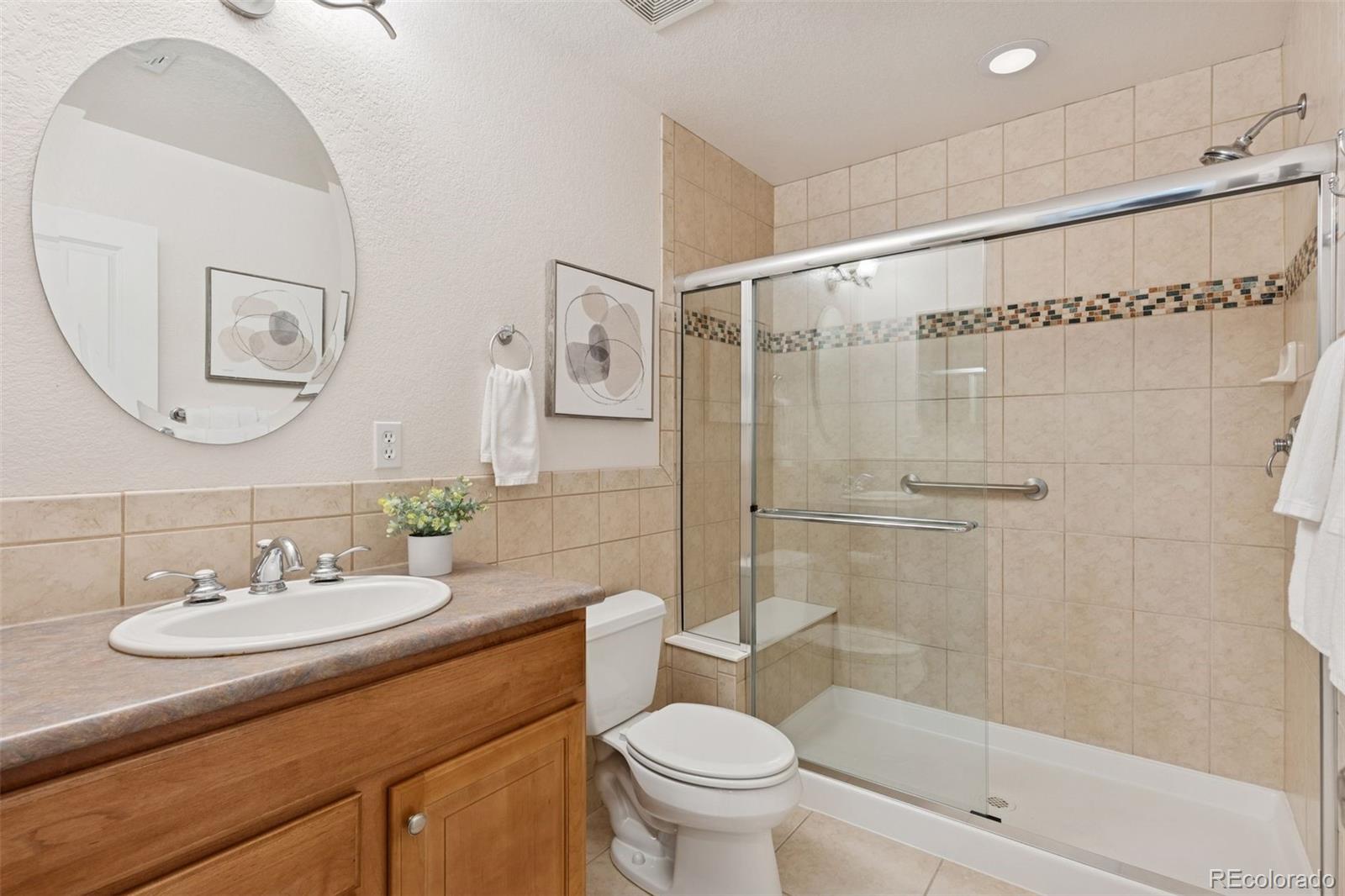2872 Alton Street Denver, CO 80238 - Photo 32 of 46 a bathroom with a sink a toilet and shower