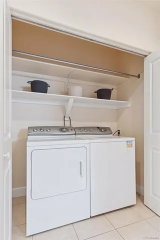 a close up of a washer and dryer with kitchen racks