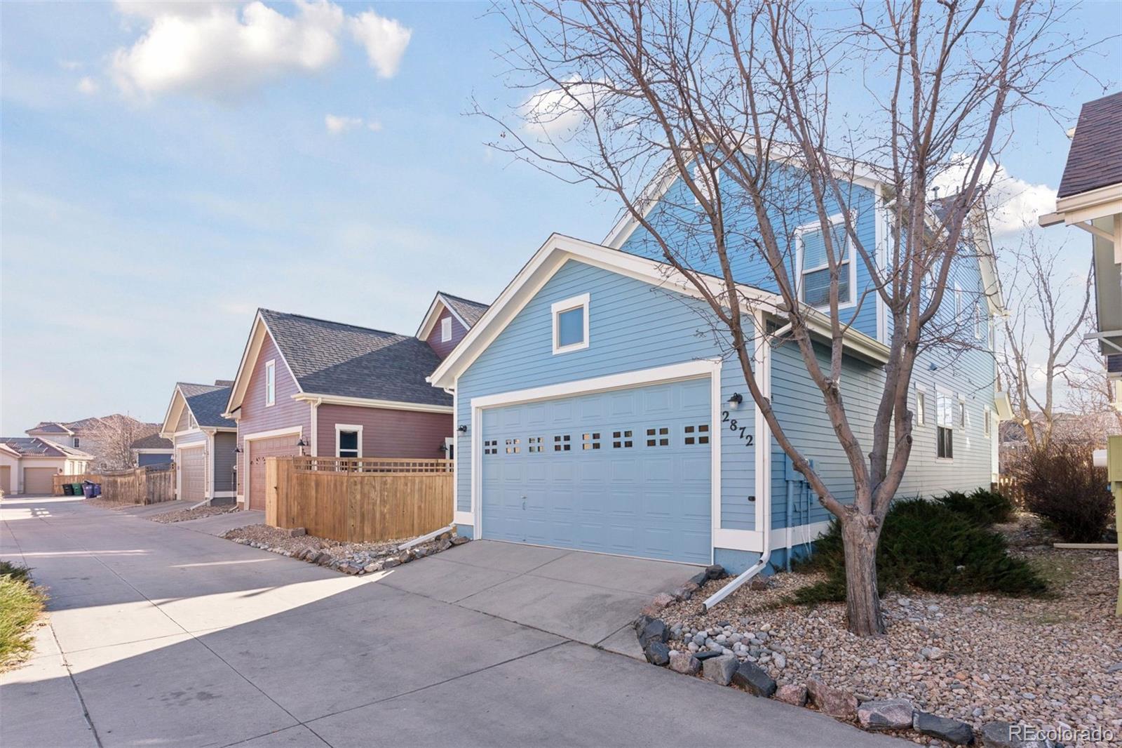 2872 Alton Street Denver, CO 80238 - Photo 36 of 46 a front view of a house with garden