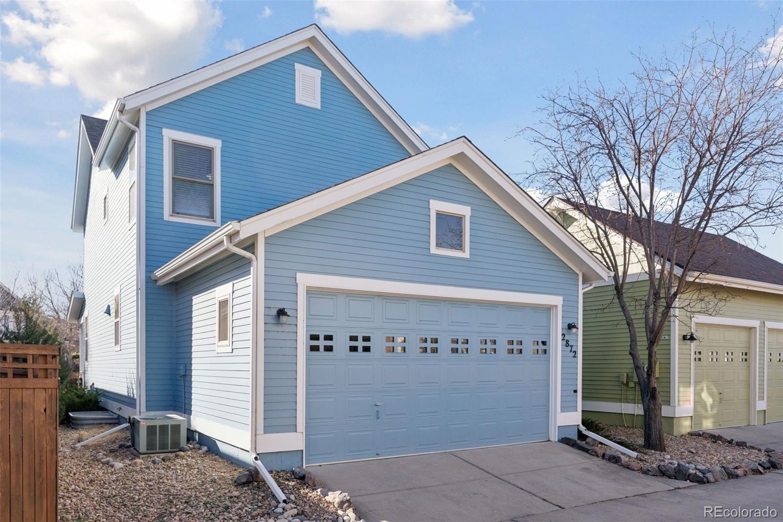 2872 Alton Street Denver, CO 80238 - Photo 38 of 46 a front view of a house with garage