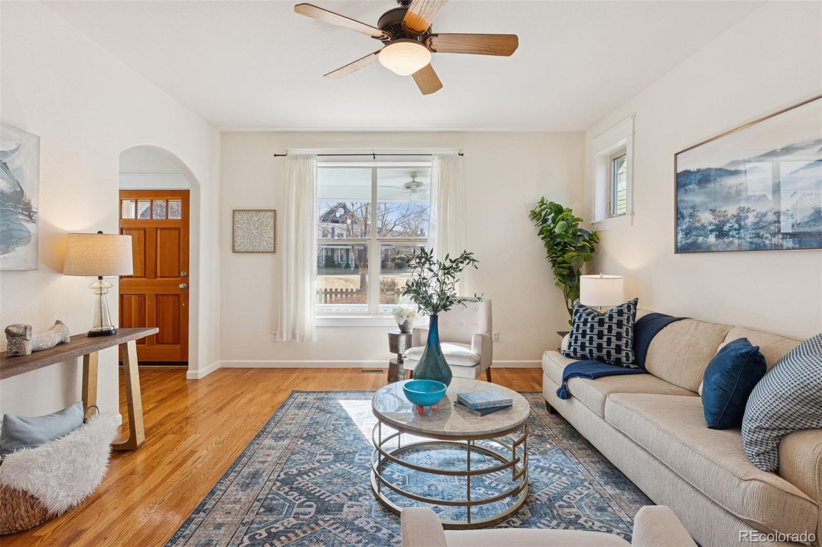 2872 Alton Street Denver, CO 80238 - Photo 6 of 46 a living room with furniture and a rug
