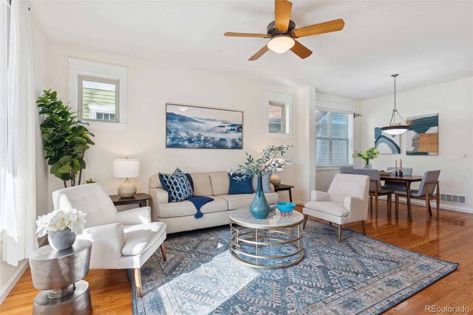 2872 Alton Street Denver, CO 80238 - Photo 7 of 46 a living room with furniture and wooden floor