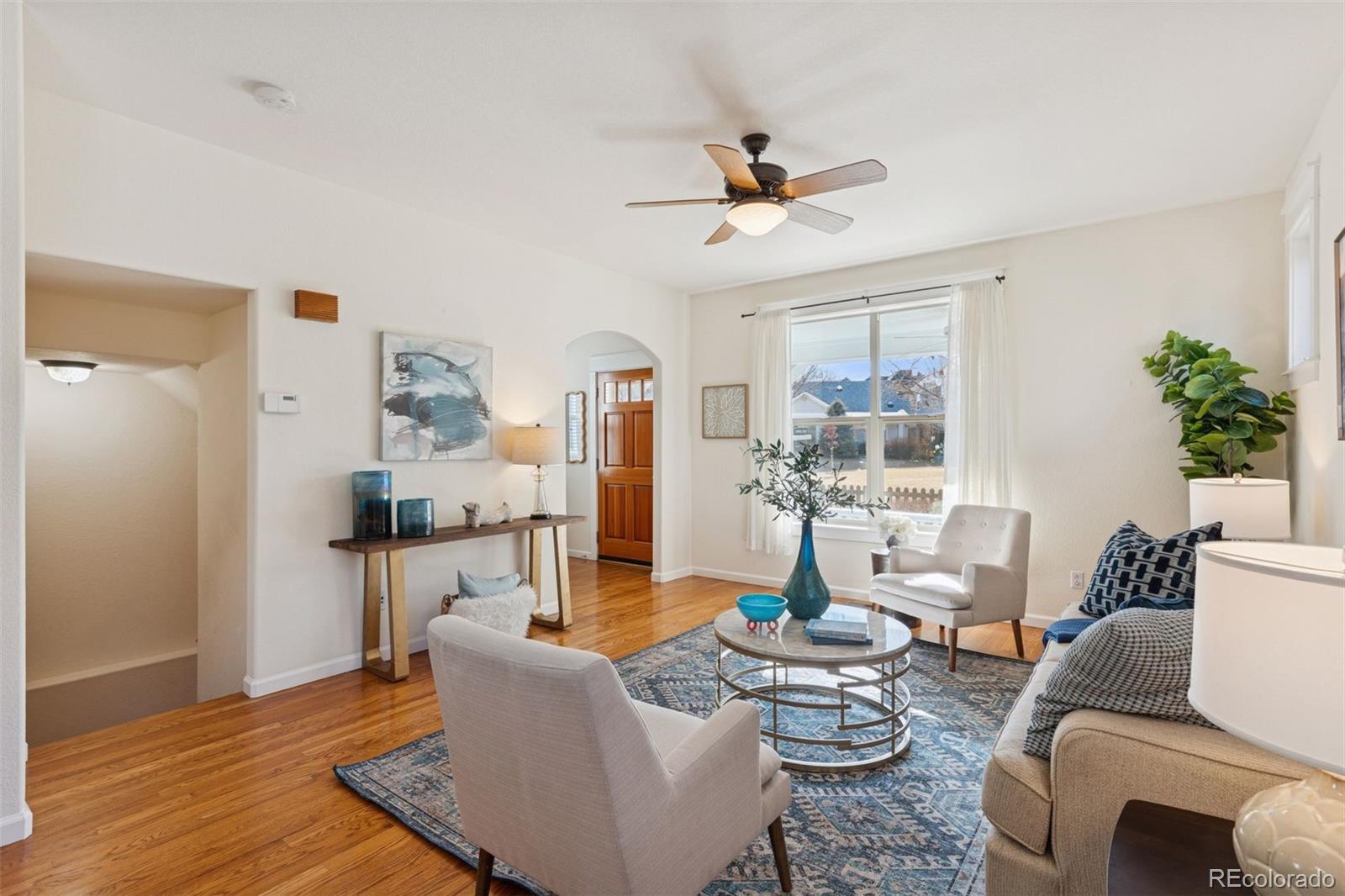 2872 Alton Street Denver, CO 80238 - Photo 8 of 46 a living room with furniture and a wooden floor