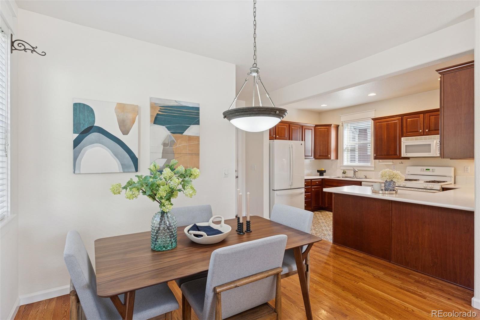 2872 Alton Street Denver, CO 80238 - Photo 10 of 46 a living room with stainless steel appliances kitchen island granite countertop furniture and a kitchen view