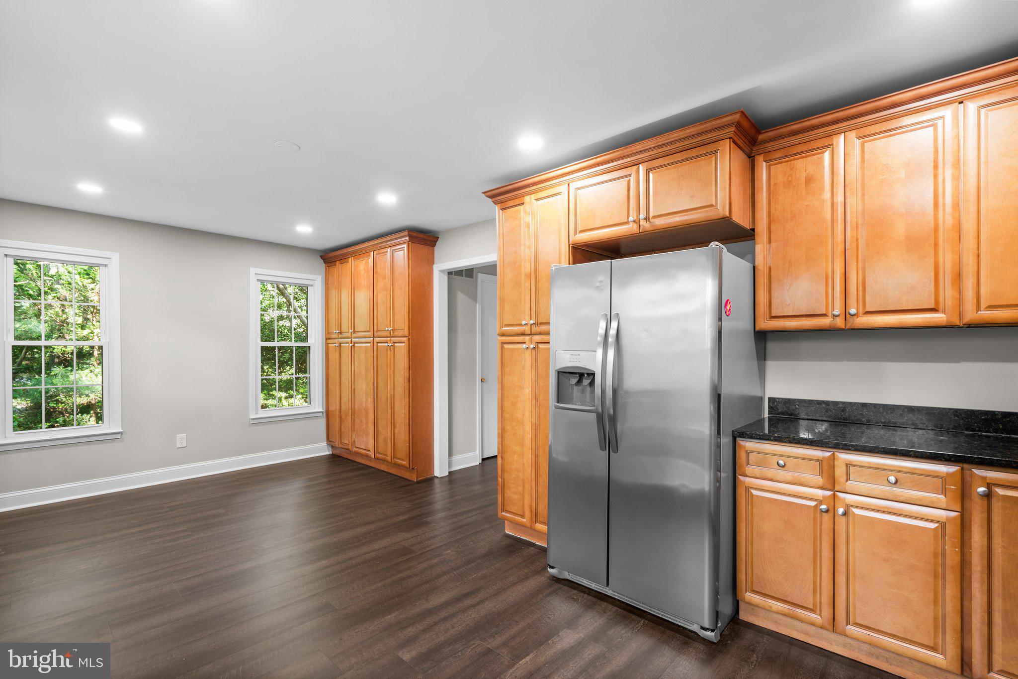 2360 Albot Road Reston, VA 20191 - Photo 12 of 35 a kitchen with stainless steel appliances granite countertop a refrigerator and wooden floor