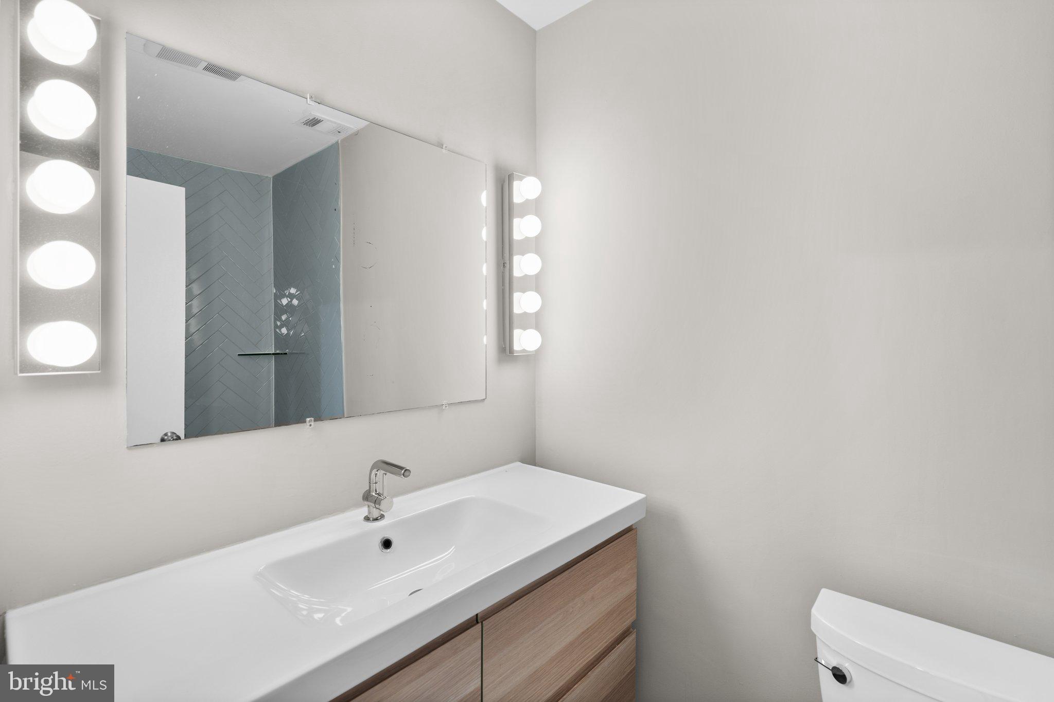 2360 Albot Road Reston, VA 20191 - Photo 17 of 35 a bathroom with a sink and a mirror