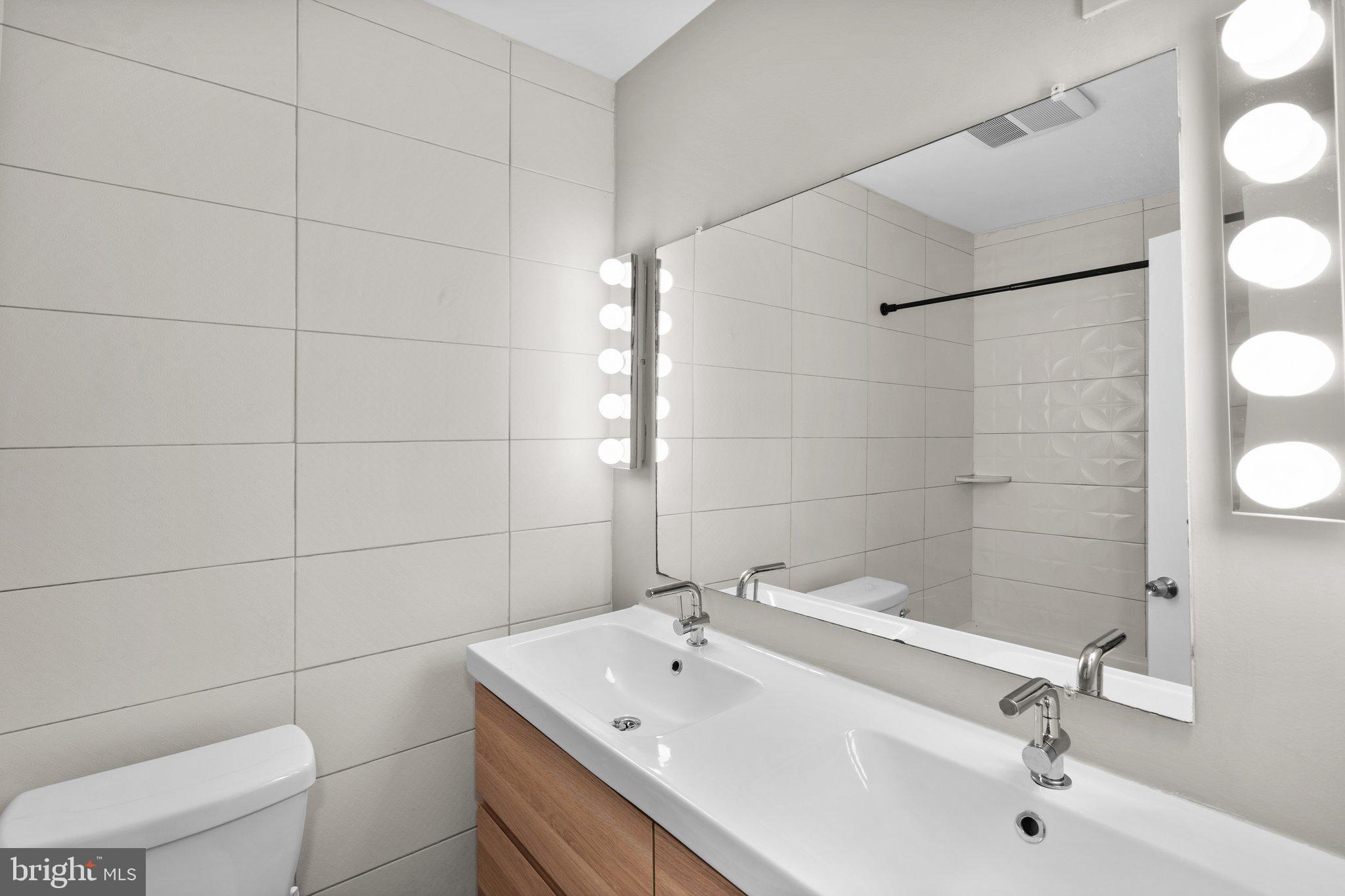 2360 Albot Road Reston, VA 20191 - Photo 24 of 35 a bathroom with a sink a toilet and shower