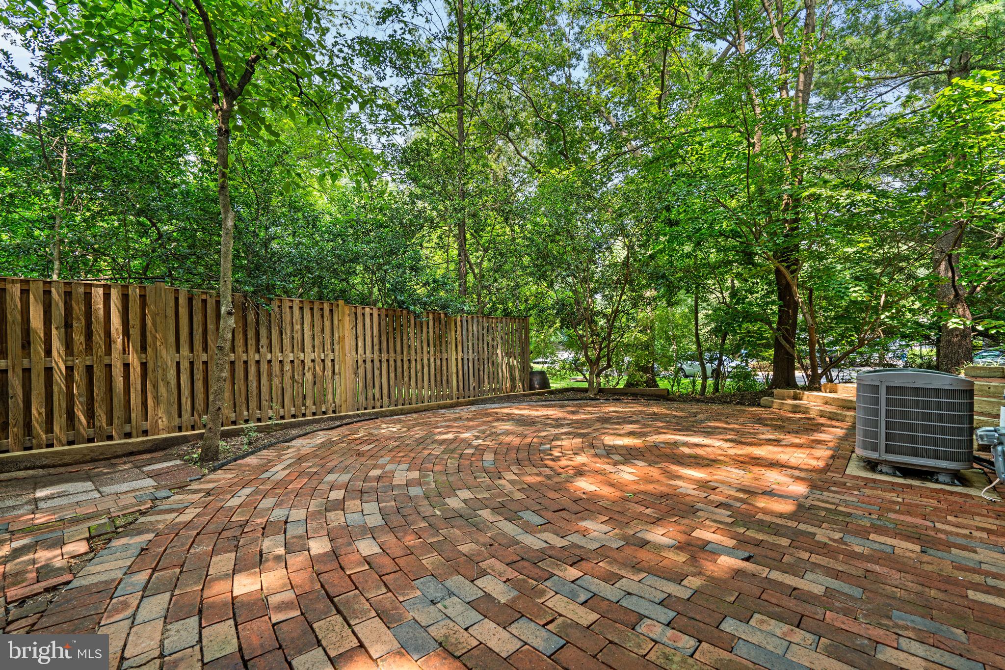 2360 Albot Road Reston, VA 20191 - Photo 29 of 35 a view of backyard with wooden fence and large trees