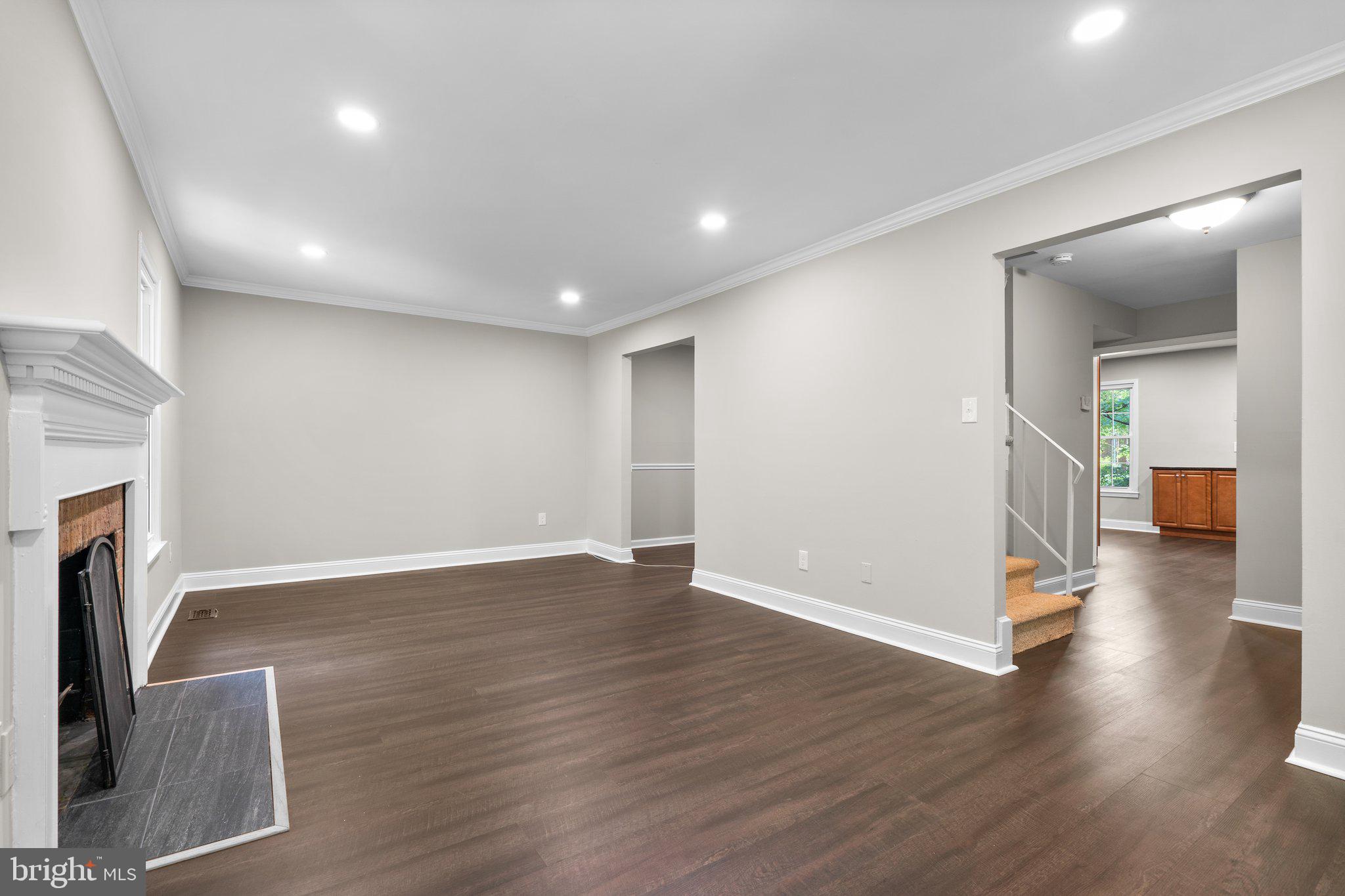 2360 Albot Road Reston, VA 20191 - Photo 6 of 35 a view of a livingroom with wooden floor and a fireplace