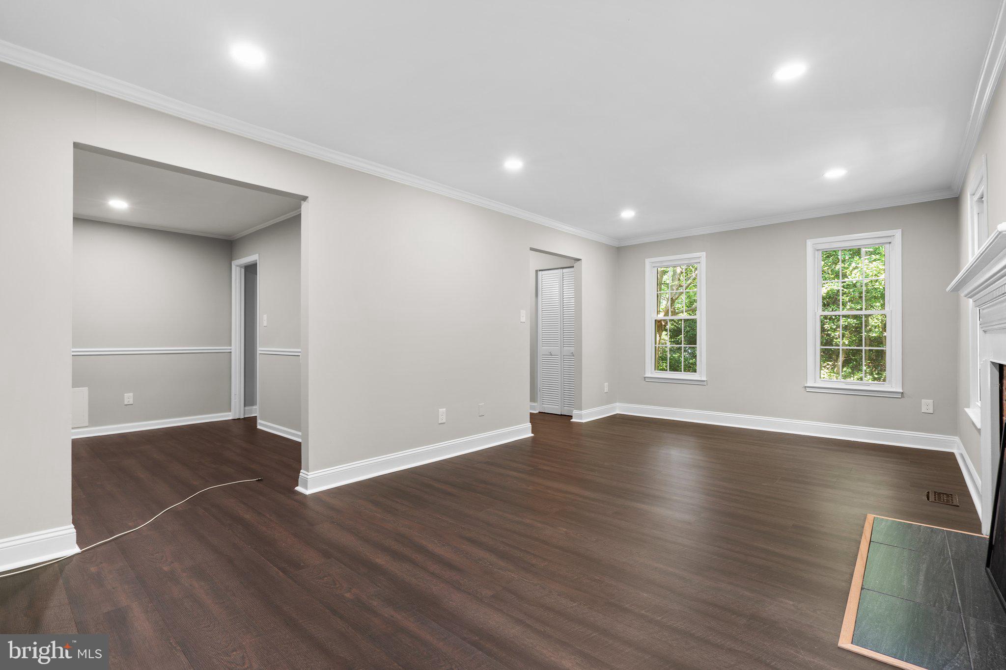 2360 Albot Road Reston, VA 20191 - Photo 7 of 35 a view of an empty room with wooden floor and a window