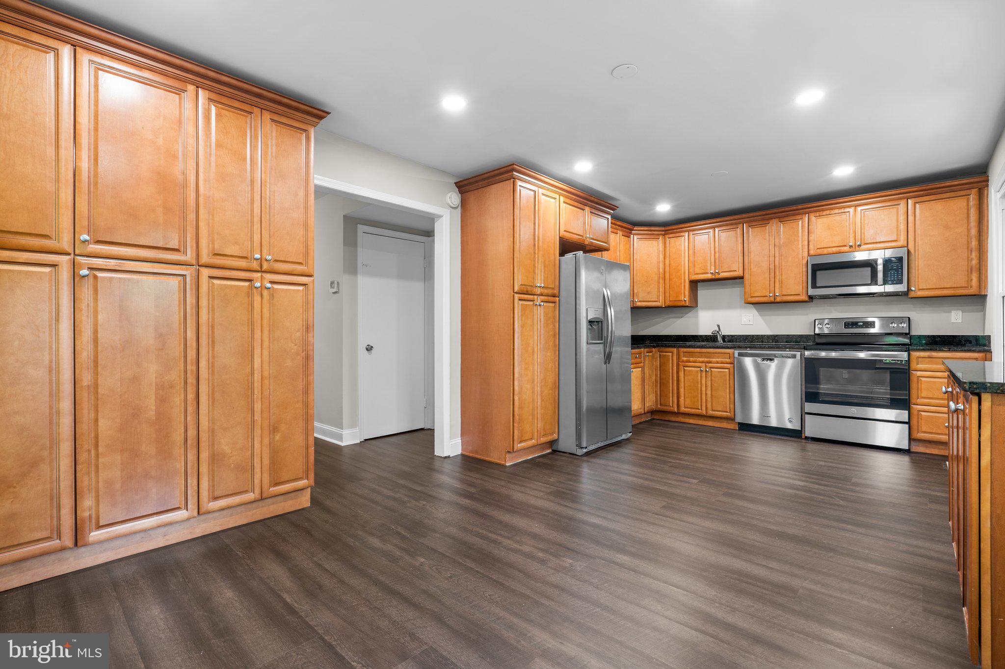 2360 Albot Road Reston, VA 20191 - Photo 10 of 35 a view of kitchen with stainless steel appliances granite countertop wooden cabinets and a refrigerator