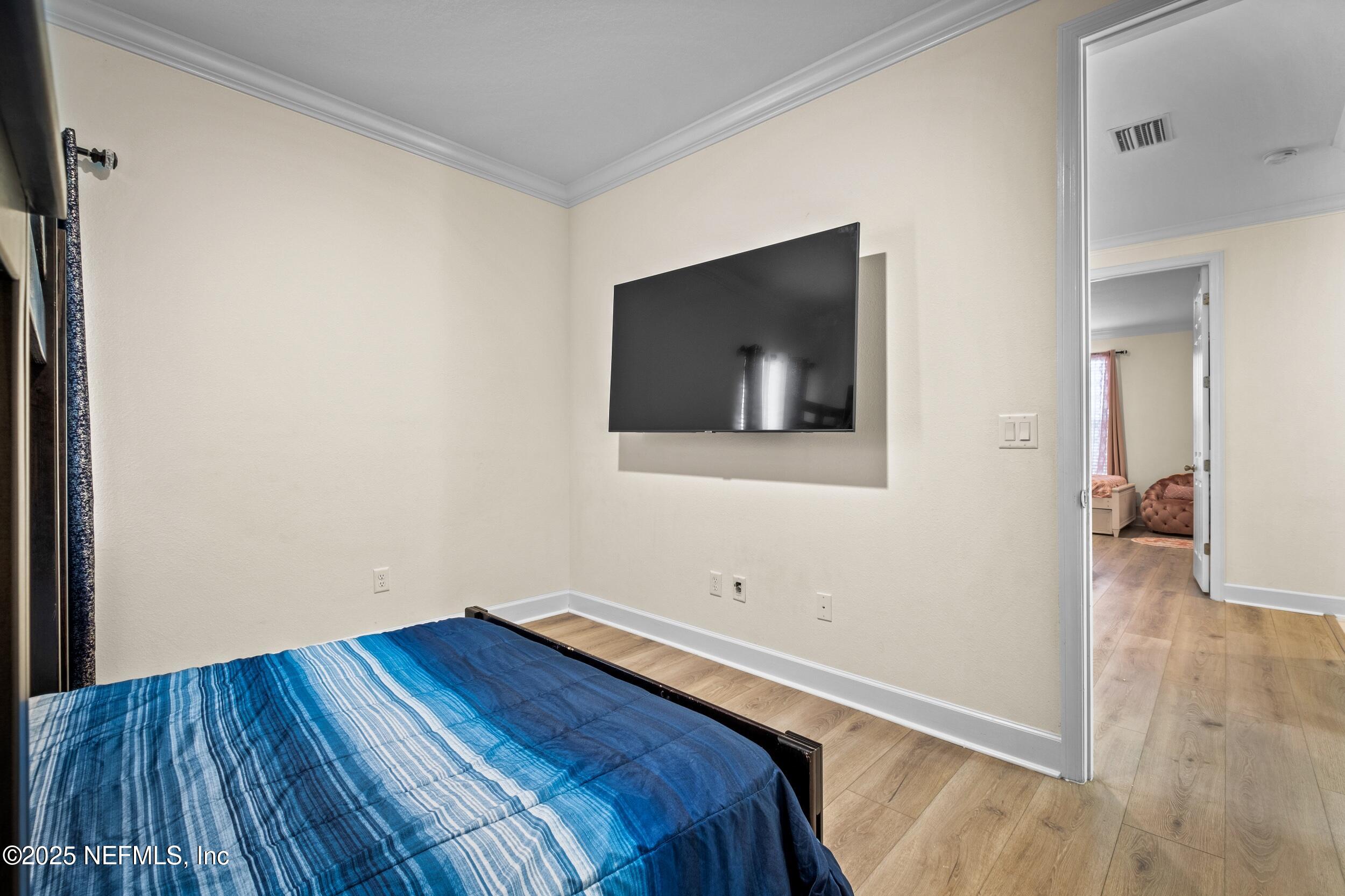 80 Widener Court St. Johns, FL 32259 - Photo 15 of 60 a view of a room with wooden floor and a flat screen tv