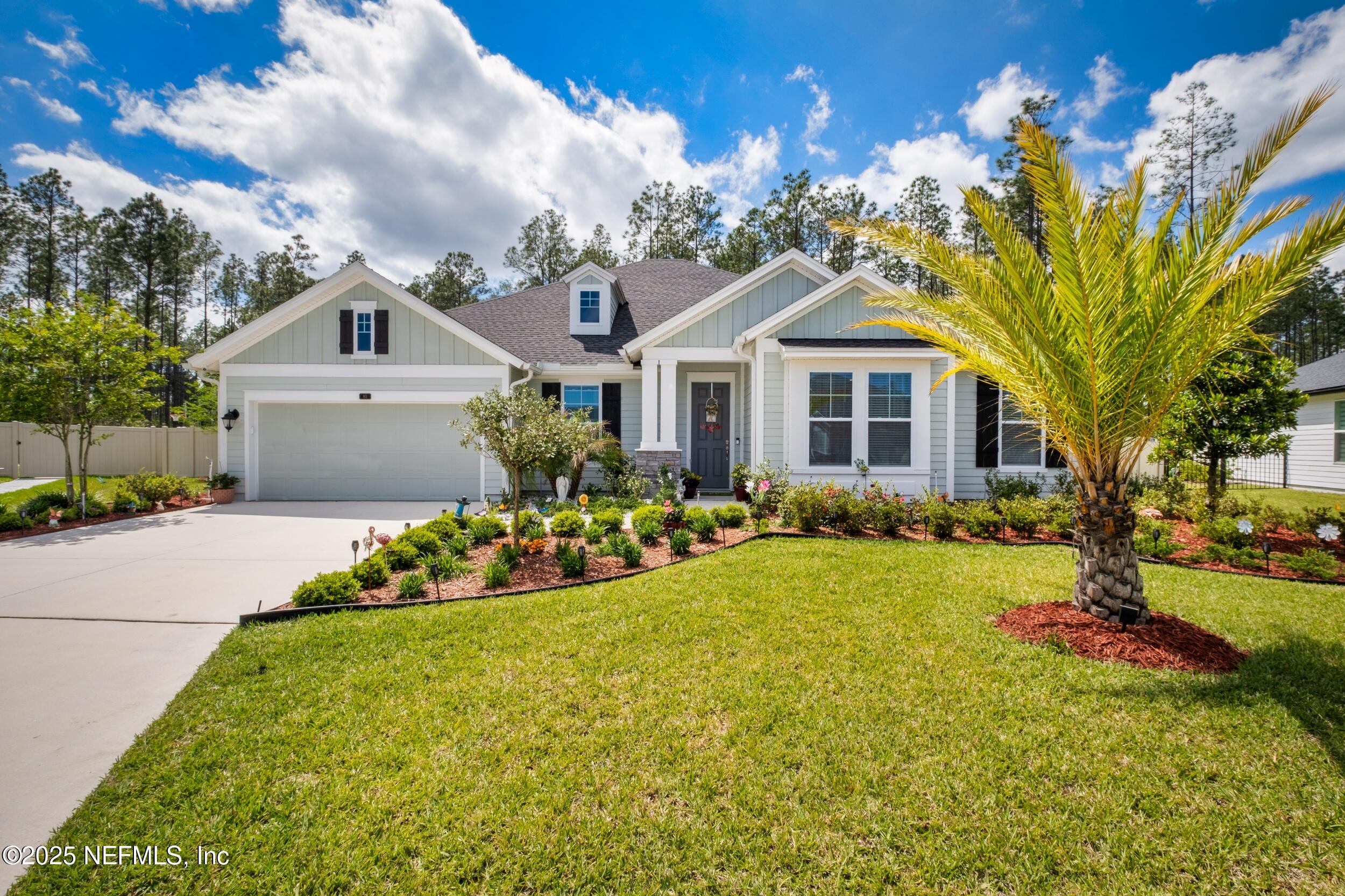80 Widener Court St. Johns, FL 32259 - Photo 3 of 60 a front view of a house with a garden and yard