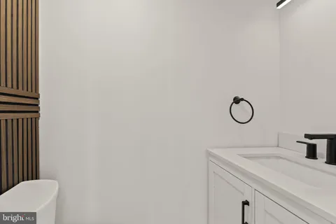 a bathroom with a sink and vanity