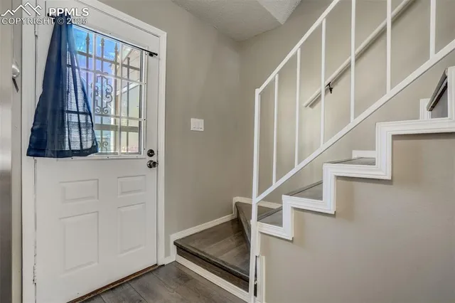 a view of entryway with a front door