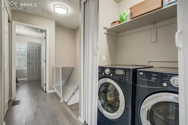 a view of a storage & utility room with washer and dryer