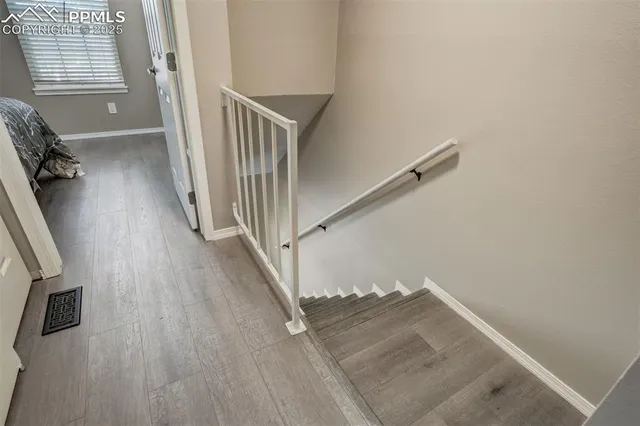 a view of a hallway with stairs