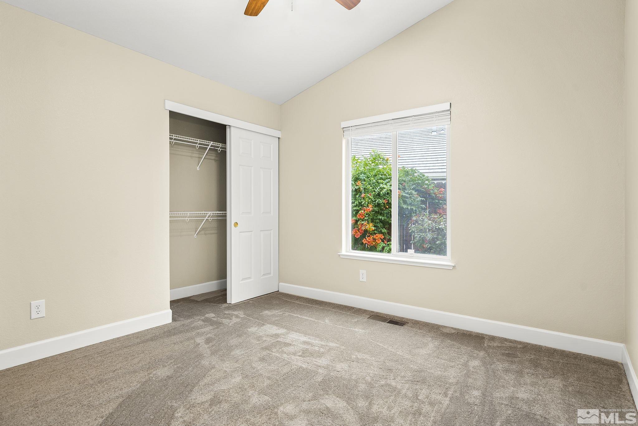 9789 Thunder Mountain Way Reno, NV 89521 - Photo 11 of 17 an empty room with windows