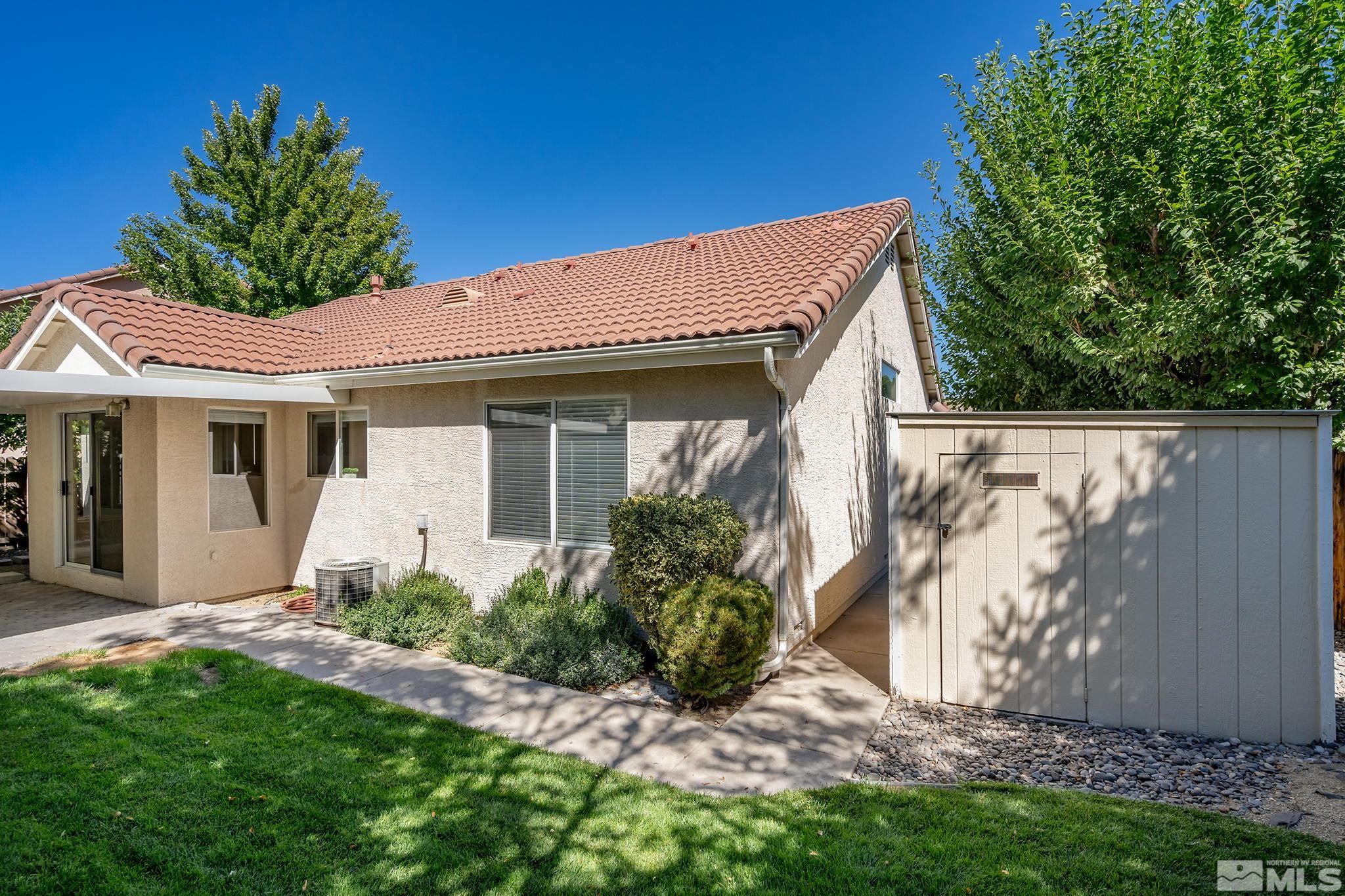 9789 Thunder Mountain Way Reno, NV 89521 - Photo 16 of 17 a view of a house with a yard and plants