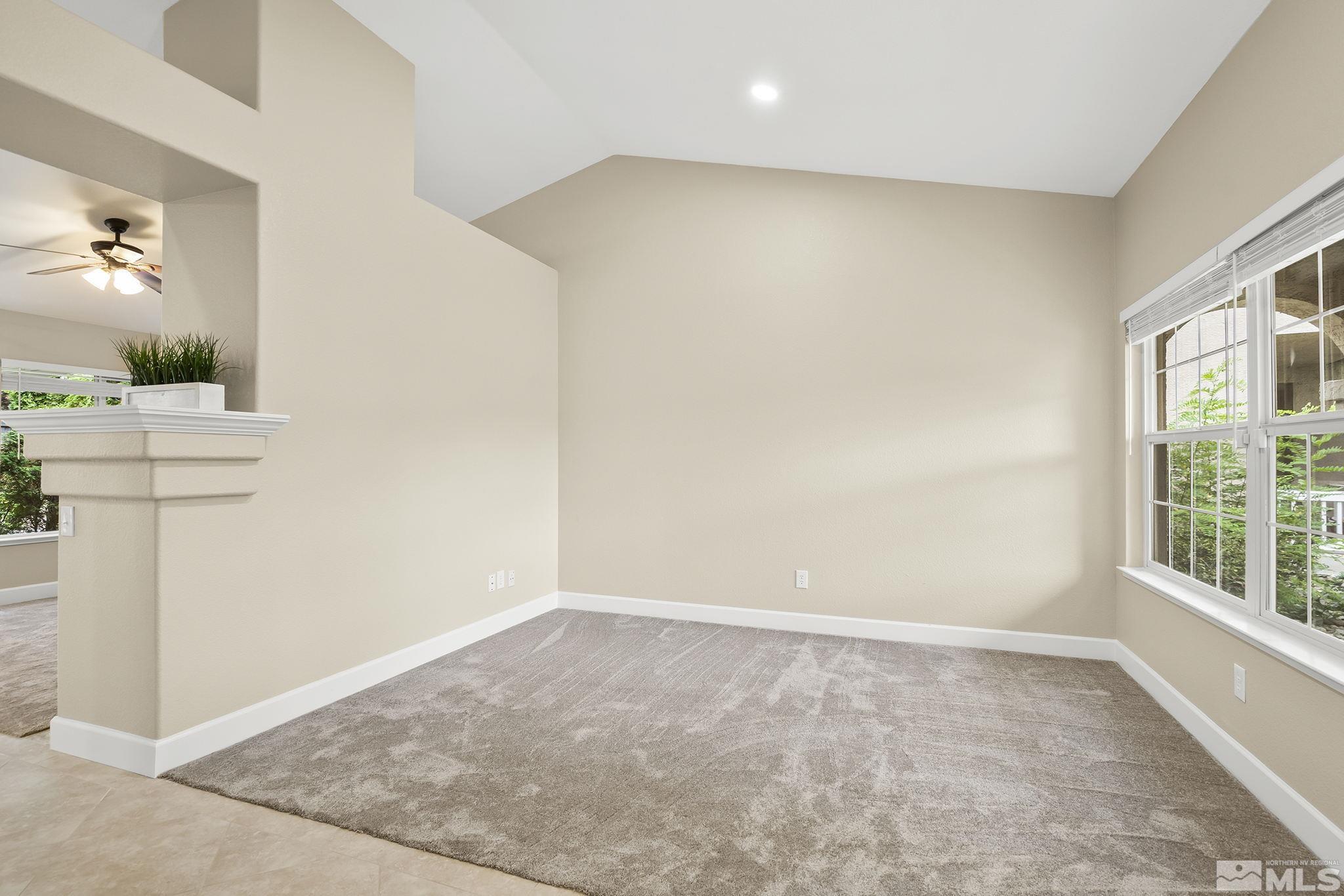 9789 Thunder Mountain Way Reno, NV 89521 - Photo 7 of 17 an empty room with a window