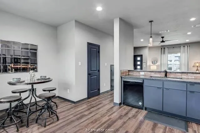 a kitchen with stainless steel appliances granite countertop a stove and a refrigerator