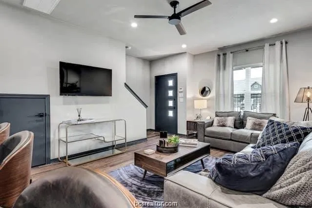 a living room with furniture and a flat screen tv