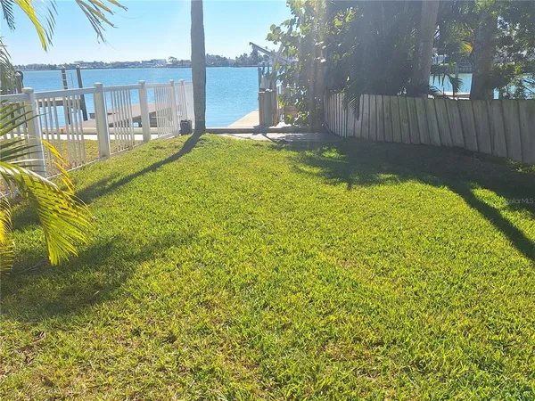 a view of swimming pool with outdoor seating and yard