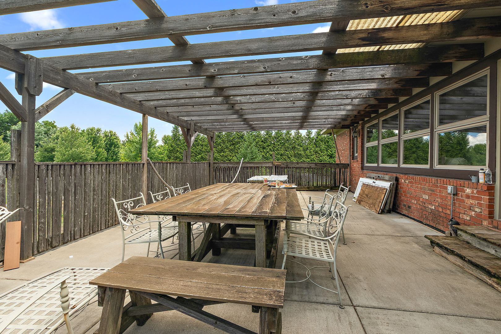 7860 West Steger Road Frankfort, IL 60423 - Photo 50 of 56 a view of a patio with table and chairs a barbeque with wooden floor and fence
