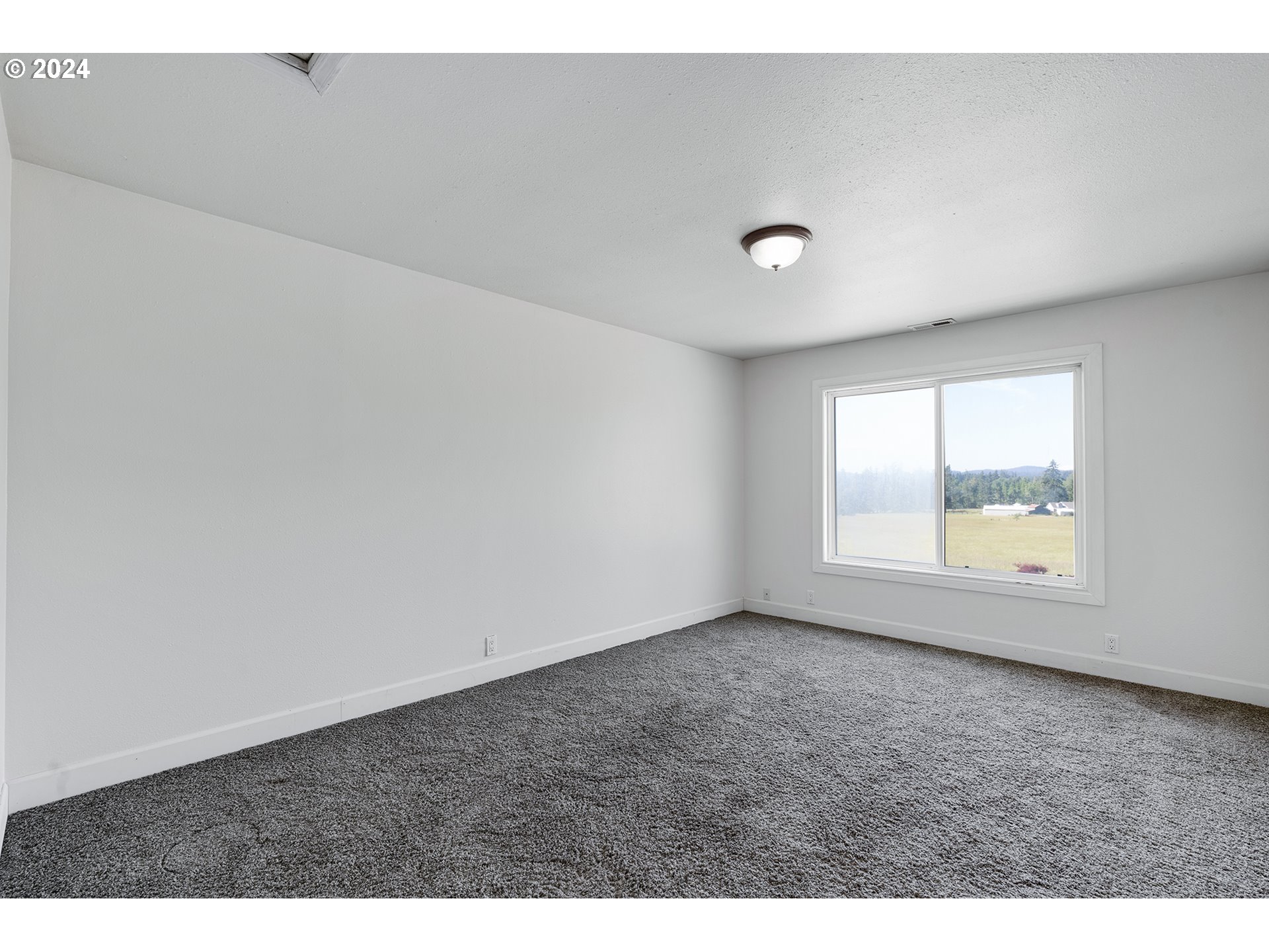 18505 South Redland Road Oregon City, OR 97045 - Photo 37 of 48 a view of an empty room with a window