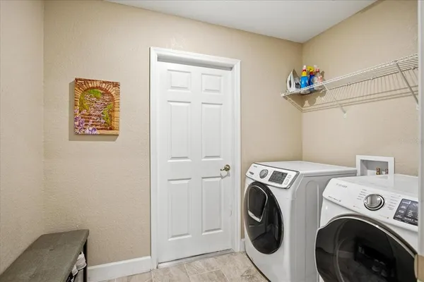 a utility room with dryer and washer
