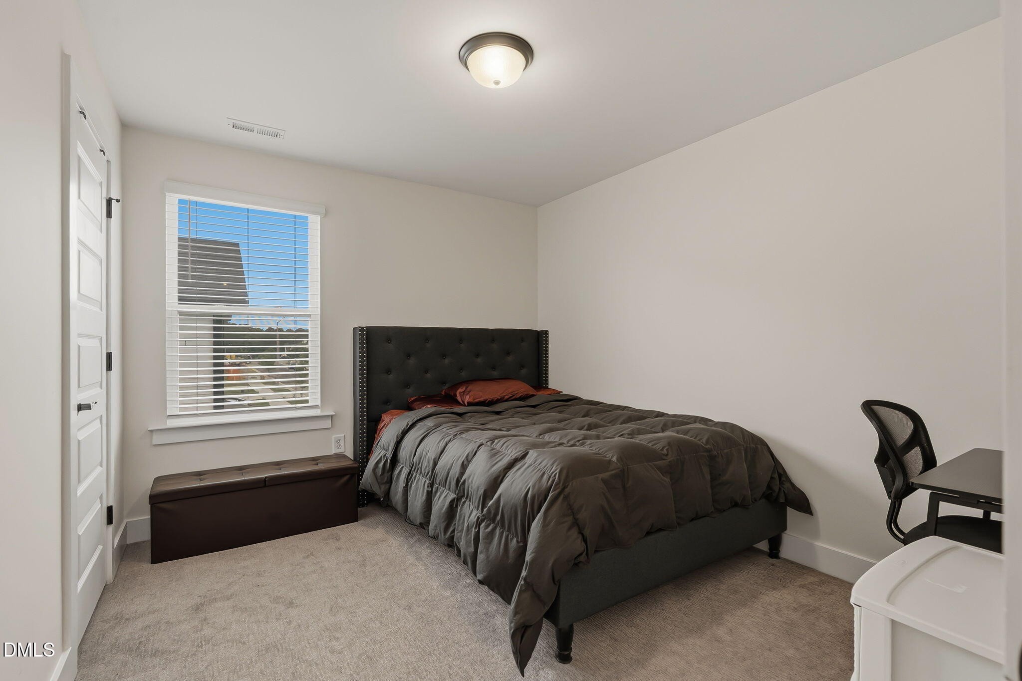 438 Diversity Way Raleigh, NC 27610 - Photo 23 of 33 a bedroom with a bed and a window