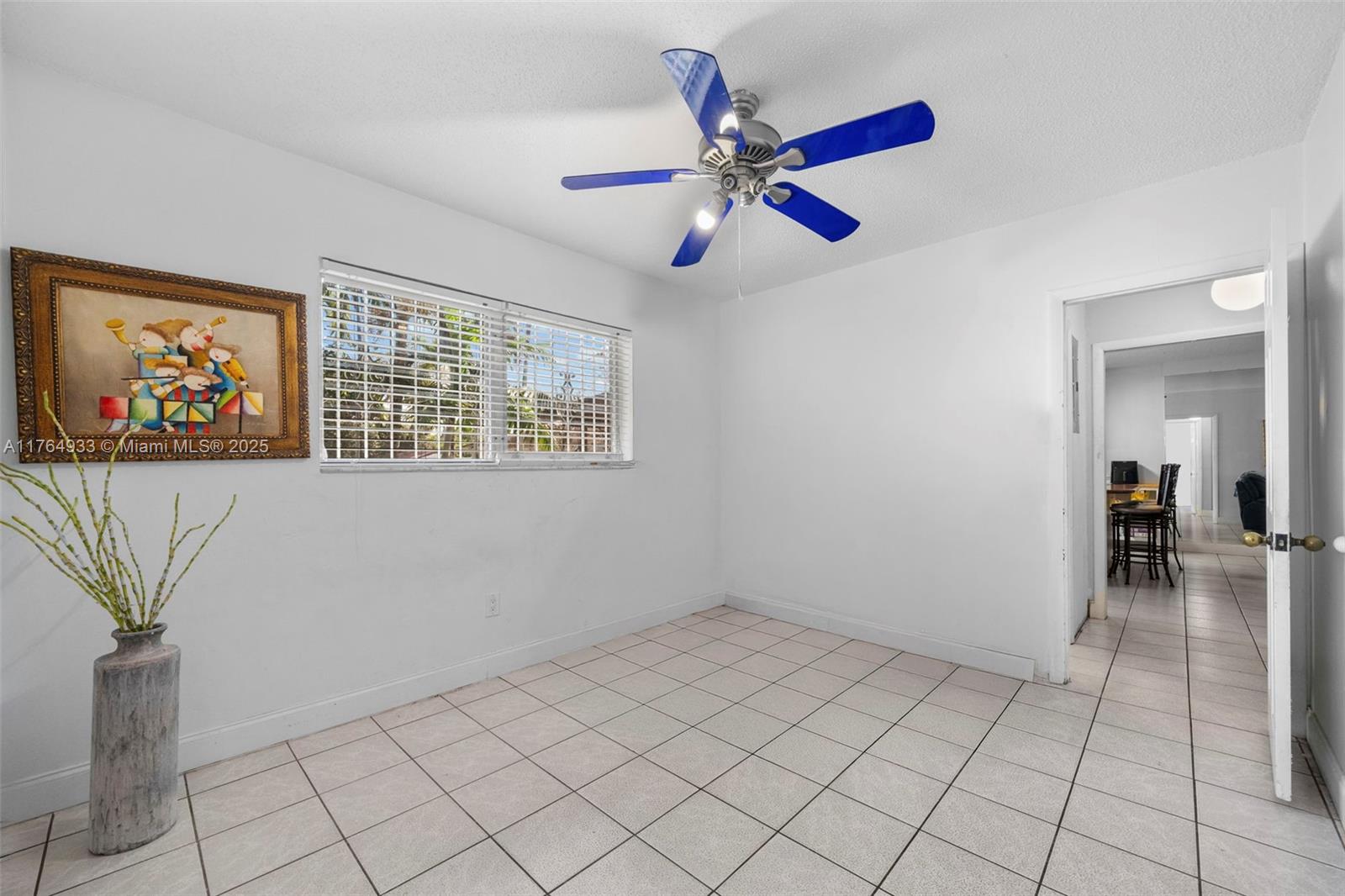 5810 Southwest 22nd Street Miami, FL 33155 - Photo 17 of 54 a view of an empty room with window and wooden floor