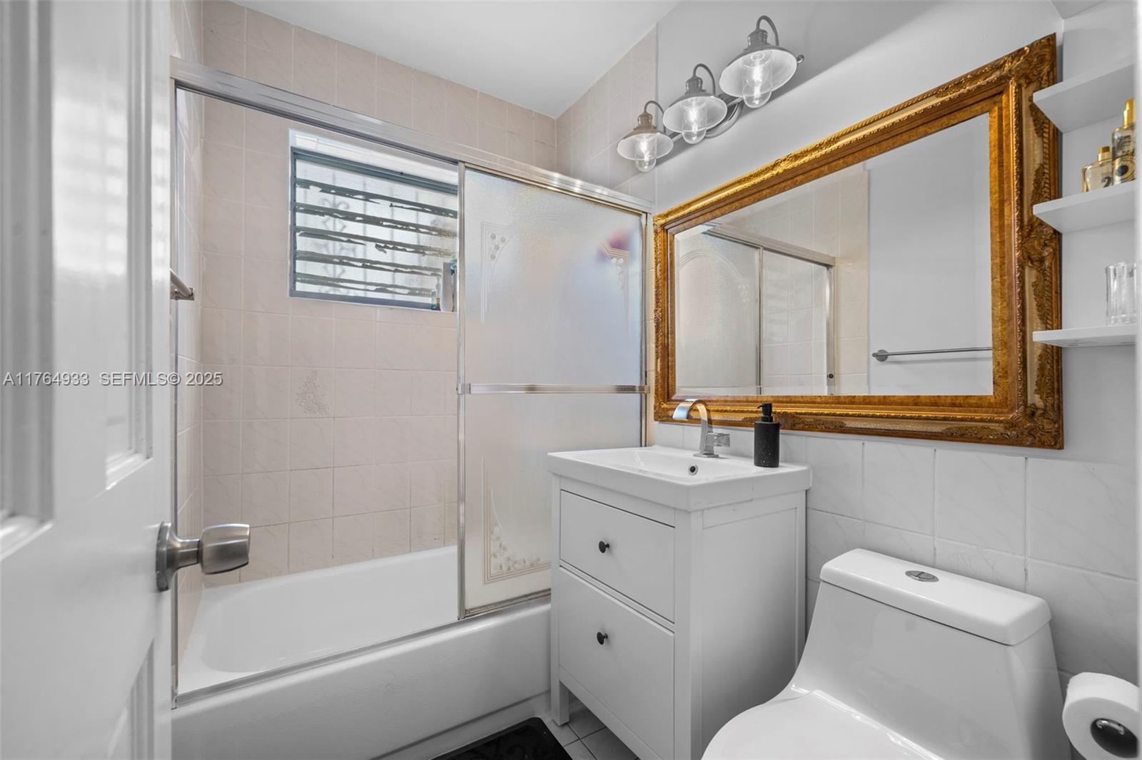 5810 Southwest 22nd Street Miami, FL 33155 - Photo 18 of 54 a bathroom with a sink a toilet and shower
