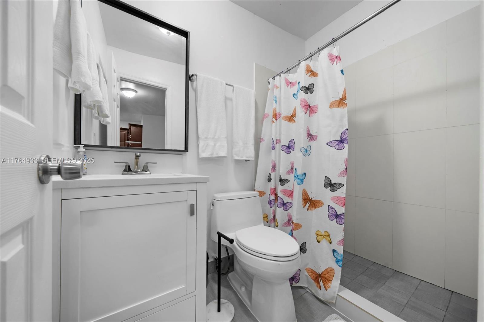 5810 Southwest 22nd Street Miami, FL 33155 - Photo 25 of 54 a bathroom with a sink toilet and shower
