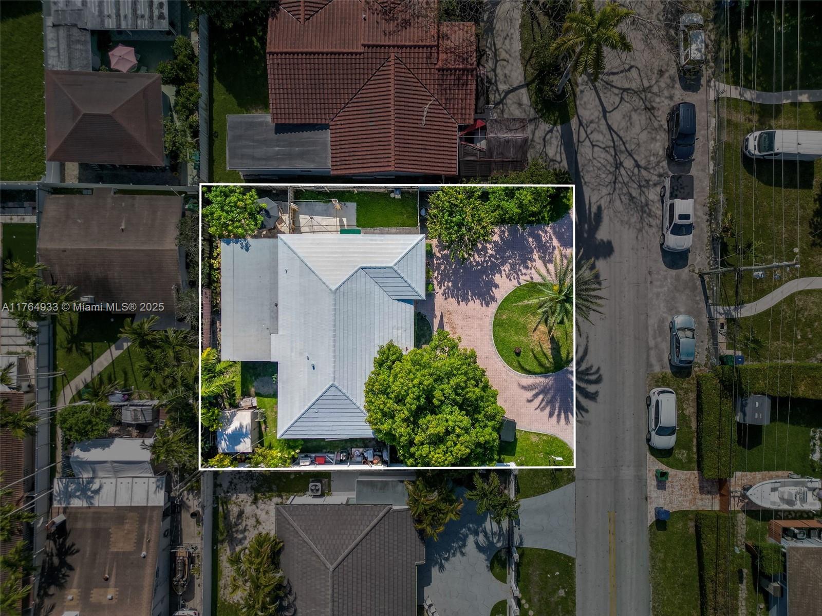 5810 Southwest 22nd Street Miami, FL 33155 - Photo 31 of 54 an aerial view of a house with a yard and large trees