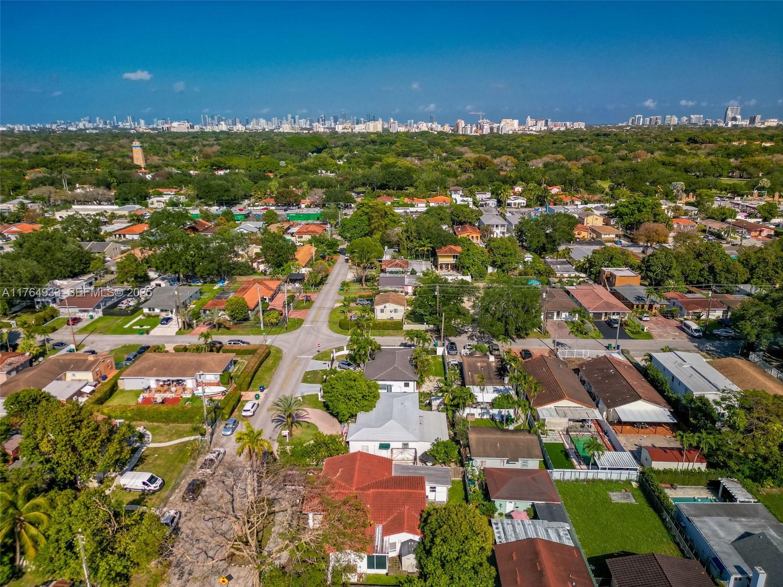 5810 Southwest 22nd Street Miami, FL 33155 - Photo 38 of 54 an aerial view of residential houses with outdoor space and ocean view