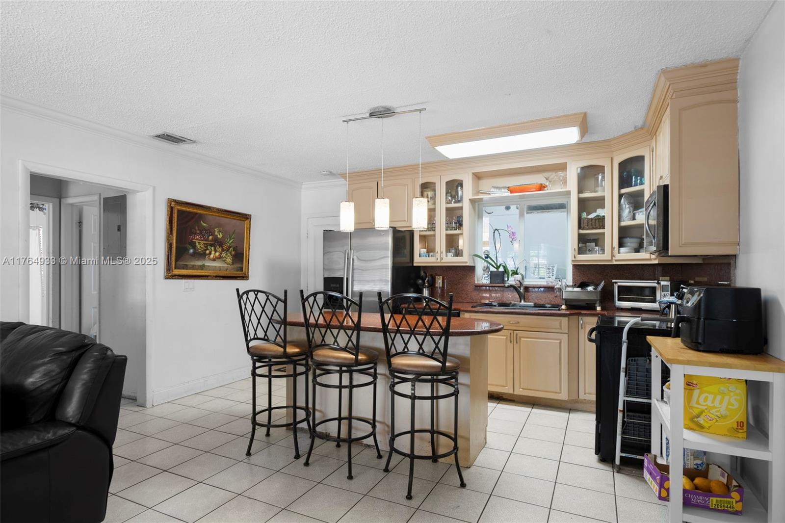 5810 Southwest 22nd Street Miami, FL 33155 - Photo 9 of 54 a view of a dining room with furniture and a kitchen
