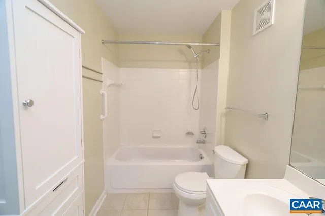 a bathroom with a toilet and a bathtub