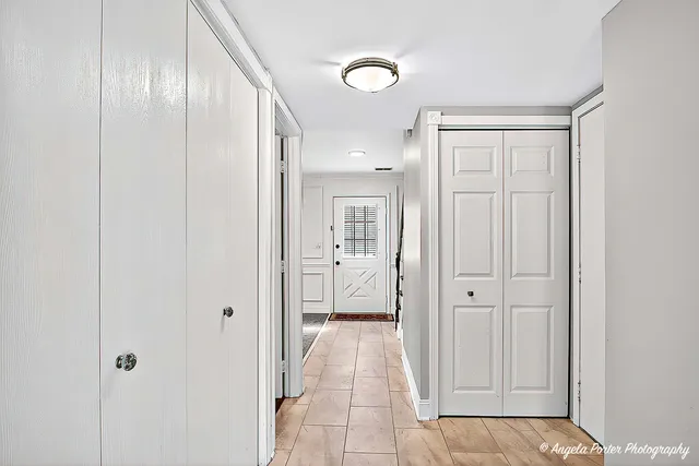 a view of an empty room with a window