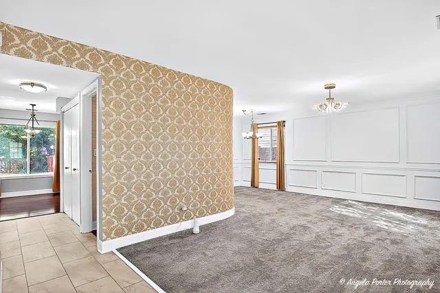 a bathroom with a granite countertop sink toilet and mirror