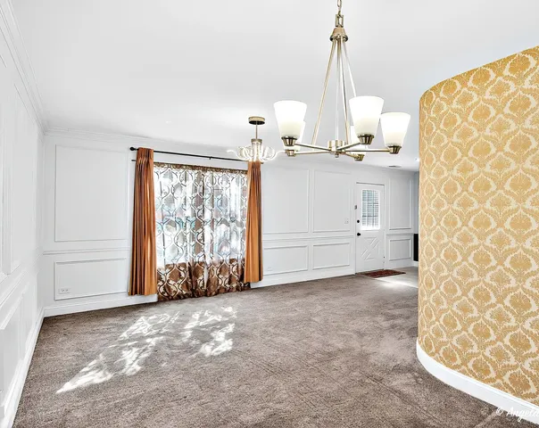 a kitchen with stainless steel appliances granite countertop a stove sink and refrigerator