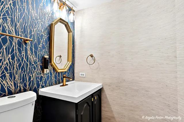 a kitchen with granite countertop a sink and a stove