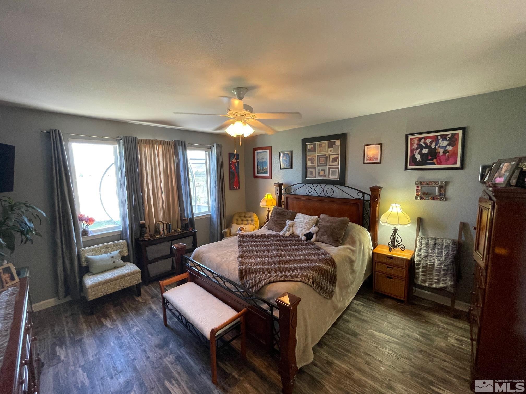10635 Fire Poppy Circle Reno, NV 89521 - Photo 13 of 33 a bedroom with a bed and wooden floor