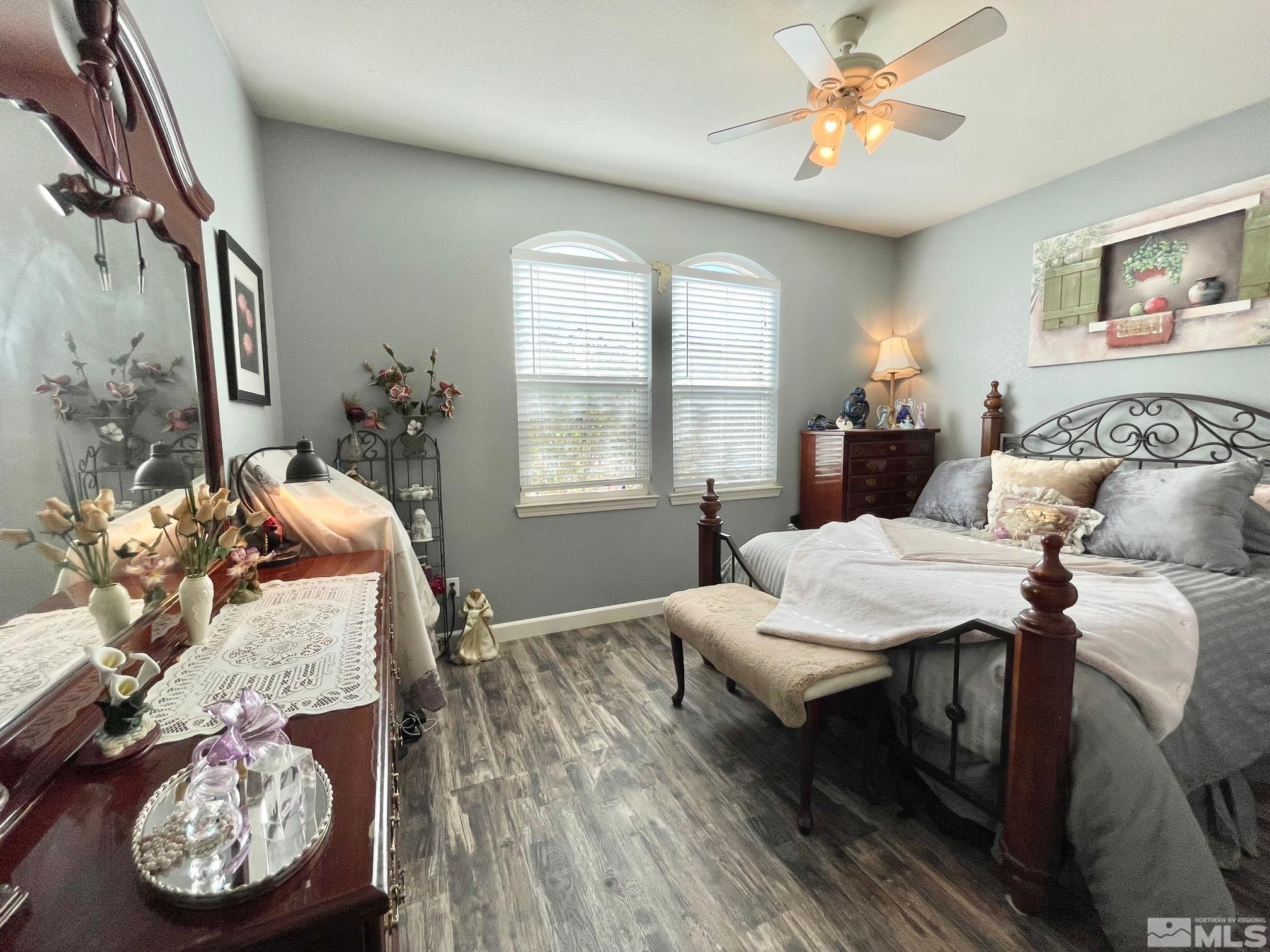 10635 Fire Poppy Circle Reno, NV 89521 - Photo 18 of 33 a bedroom with a bed and a chandelier