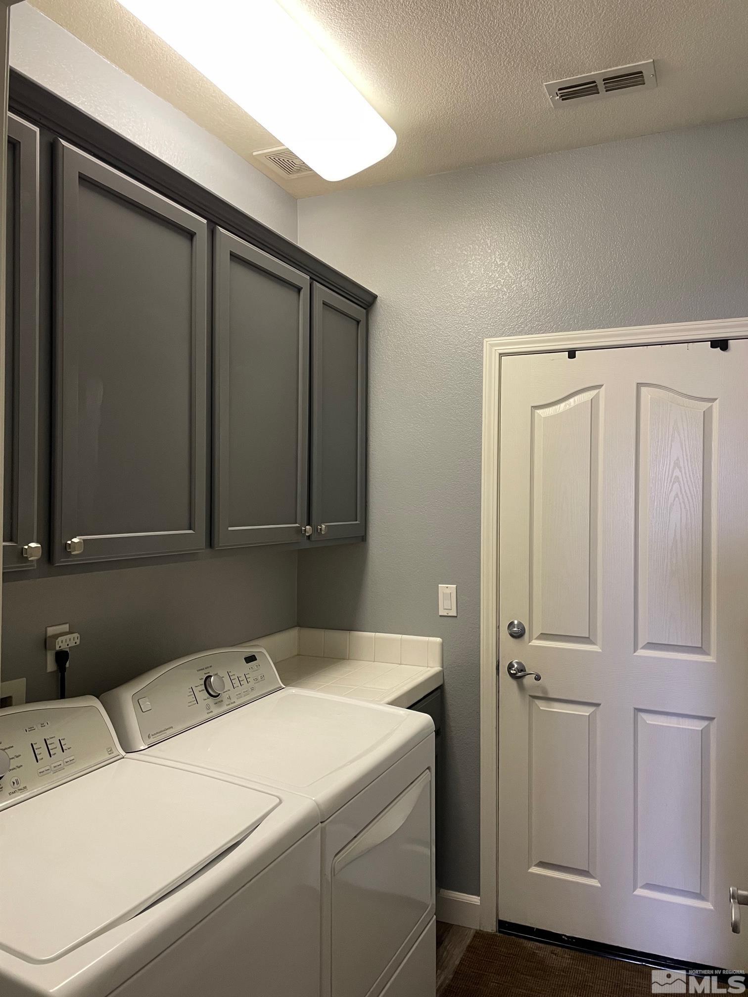 10635 Fire Poppy Circle Reno, NV 89521 - Photo 25 of 33 a utility room with dryer and washer
