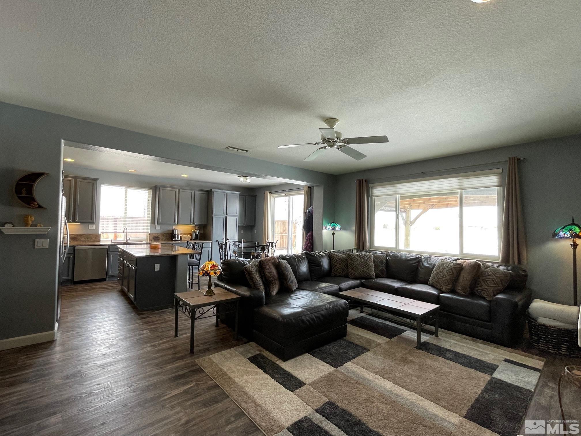 10635 Fire Poppy Circle Reno, NV 89521 - Photo 5 of 33 a living room with furniture and wooden floor